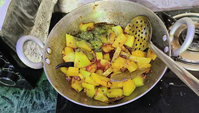 Add roasted fenugreek (kasuri methi) and garam masala.