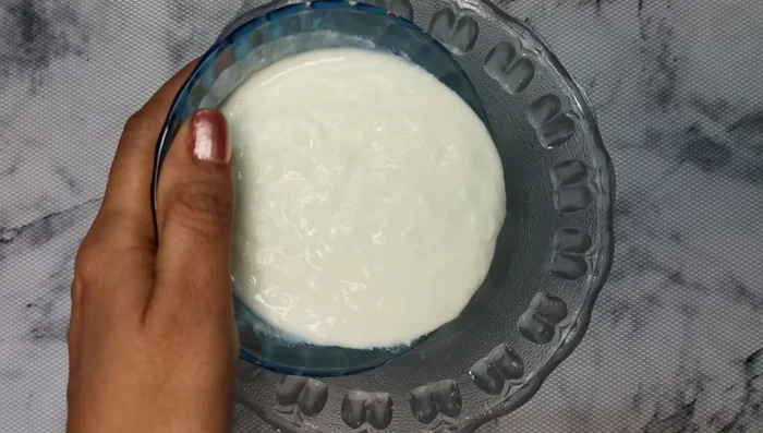 In a bowl, take one cup of fresh, not-too-sour curd.