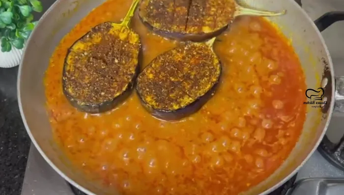 Combine brinjal and gravy: Add the fried brinjal to the gravy, mix gently, cover, and cook on low heat for 3-4 minutes on each side to allow the flavors to blend. (469.28)