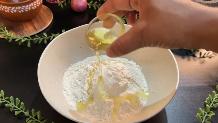 For Laccha Paratha, mix flour, salt, oil, and milk/water. Knead well, add oil, and rest for 15 minutes.
