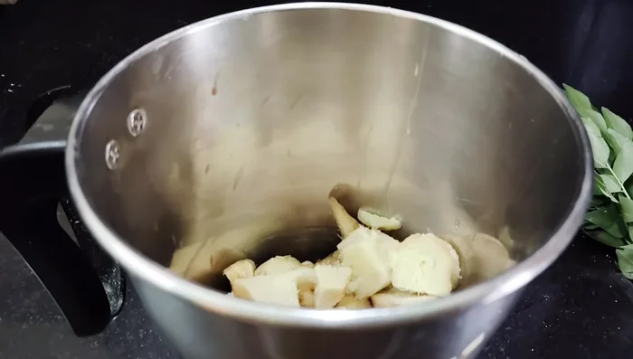 Prepare ginger-curry leaf paste: Blend ginger, curry leaves, and cumin seeds with a little water. Strain to remove fiber.