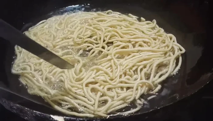 Remove karapusa from oil using a strainer and place on a plate lined with tissue paper to absorb excess oil.