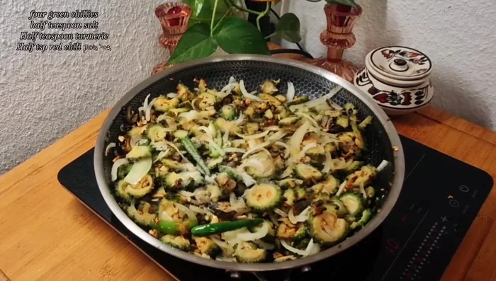 Combine the bitter gourd mixture with the minced meat mixture. Cover and cook for 10 minutes on low flame.