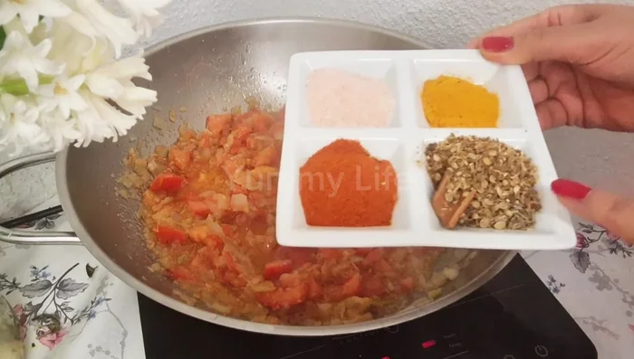 Add 3 tomatoes to the masala and fry.