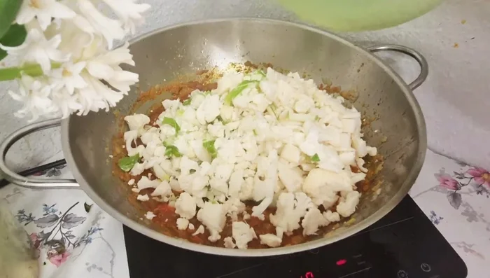 Add cabbage to the masala and mix well. Cook without adding water.