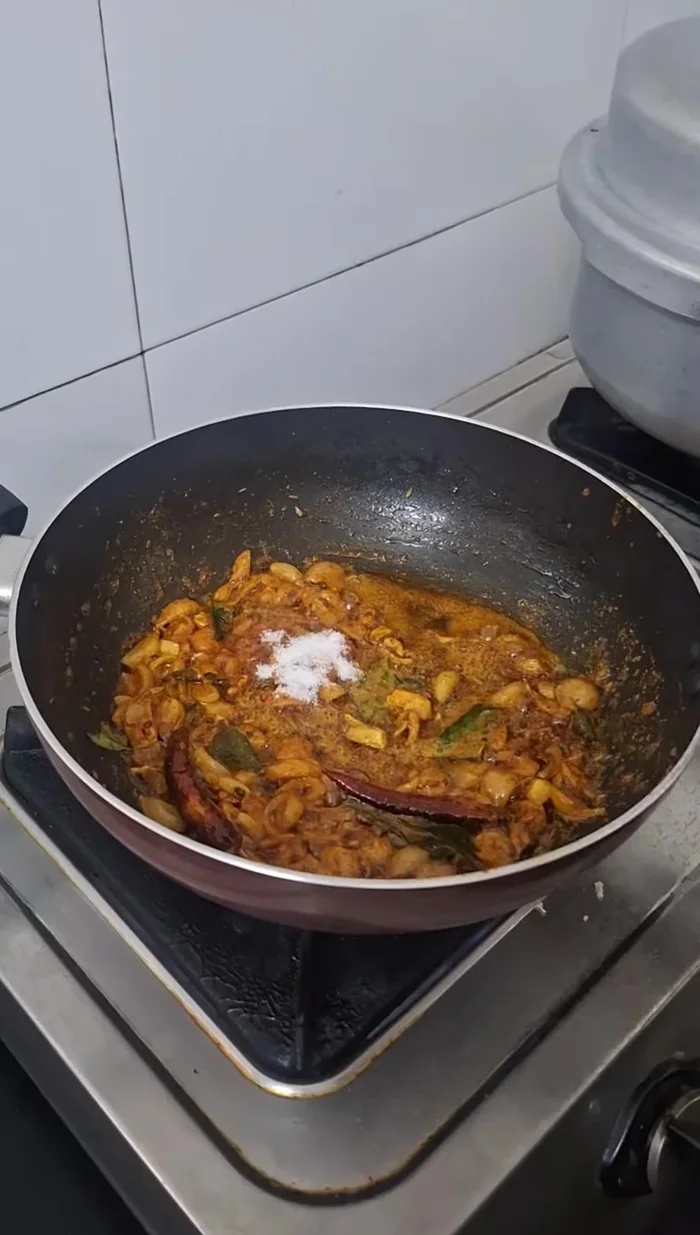 Add the prepared paste and mix. Cook on low flame until oil separates.