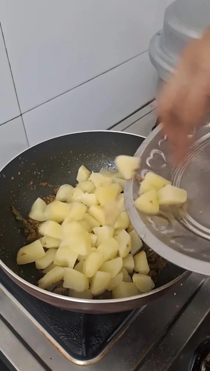 Add boiled potatoes and cook until spices and potatoes are well mixed.