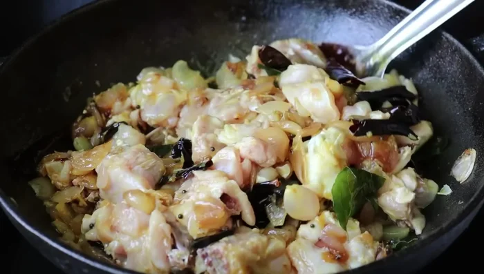 Stir well. Reduce heat, cover the pan, and cook until the oil separates. Add water if needed.