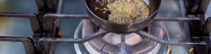 Make the tadka: Heat a little oil, add cumin seeds, curry leaves, and green chillies. Fry for a minute.