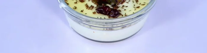 In a bowl, whisk the yogurt well. Add the prepared masala and mix thoroughly.