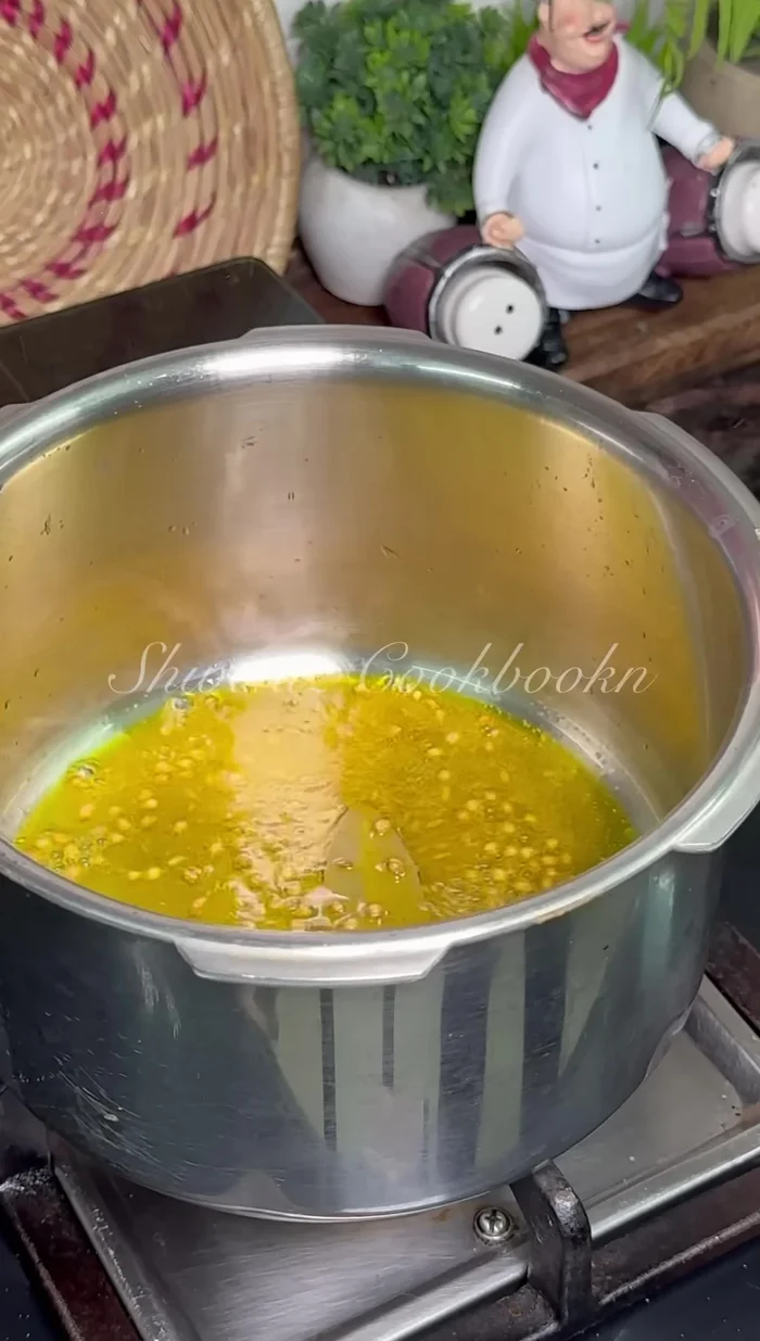 Add crushed garlic and fry until fragrant.