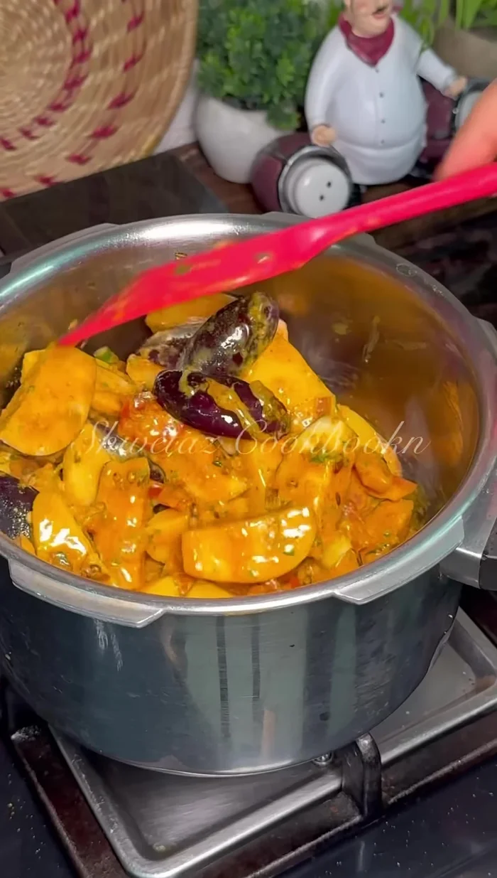 Add the marinated vegetables and some water. Mix well.