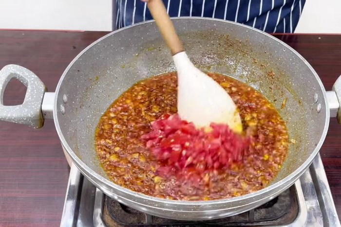 Add chopped tomatoes and cook until soft.