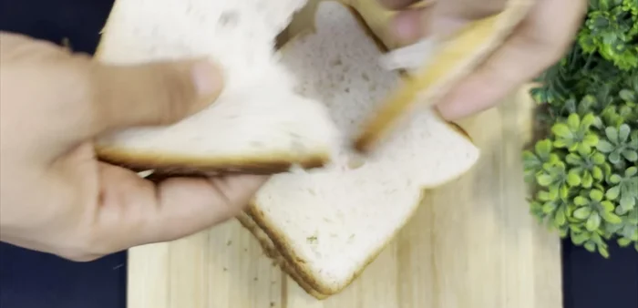 Break 6 bread slices into thick pieces and grind into a fine powder using a mixer.