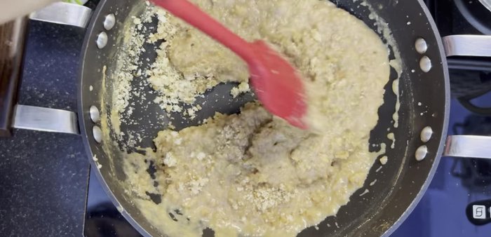 Add the roasted bread powder to the milk mixture. Stir continuously over low-medium heat until it forms a dough-like consistency.