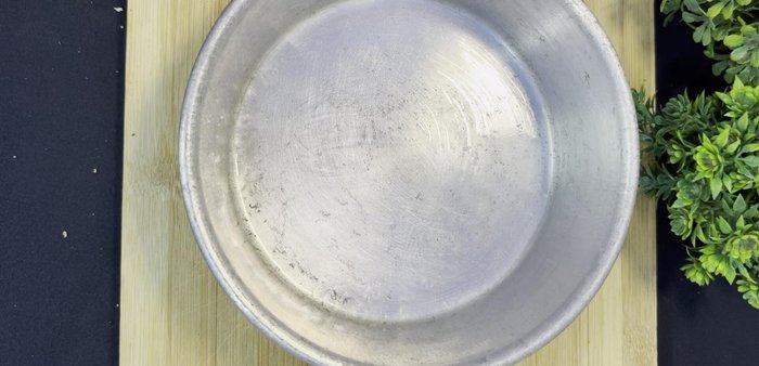 Grease a square cake tin with ghee and line with butter paper. Transfer the sweet dough into the tin and press it down firmly using a spatula.