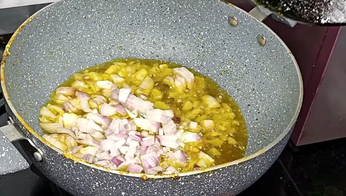 Remove the fried fish head and set aside. In the same pan, fry chopped onions until brown. (334.24)