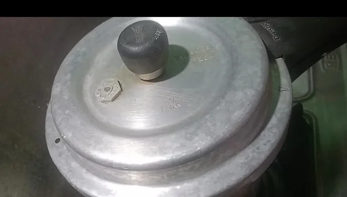 Cook on high flame for one whistle, then three whistles on low flame.