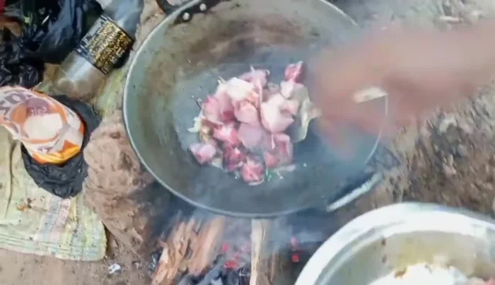 Add the cut pork to the pan and stir.