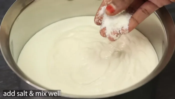 Grind the rice and urad dal into a smooth paste.
