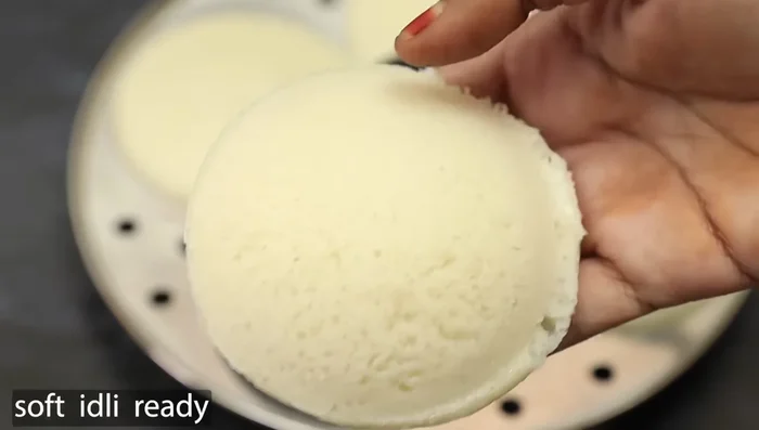 Pour the batter into the idli molds.