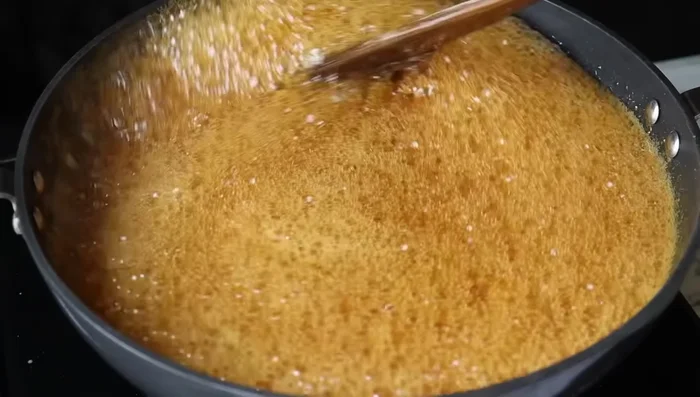 Bring the jaggery mixture to a boil for 1-2 minutes.