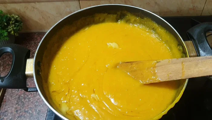 Cook until the mixture thickens and resembles halwa. This will take about 10-15 minutes, stirring constantly on low to medium heat.