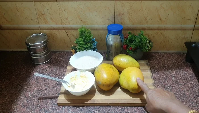 Peel and chop the mangoes into small pieces.