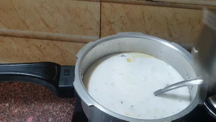 Add thick coconut milk at the end; heat gently, do not boil.