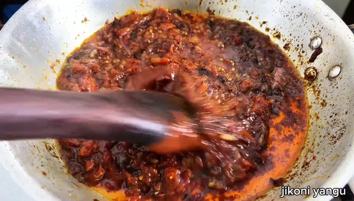 Add tomato paste and mix well.