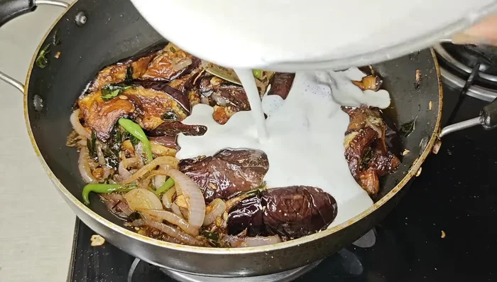 Remove from heat, and then gently stir in the blended curd. Be careful to avoid curdling the curd. Mix well to combine everything.