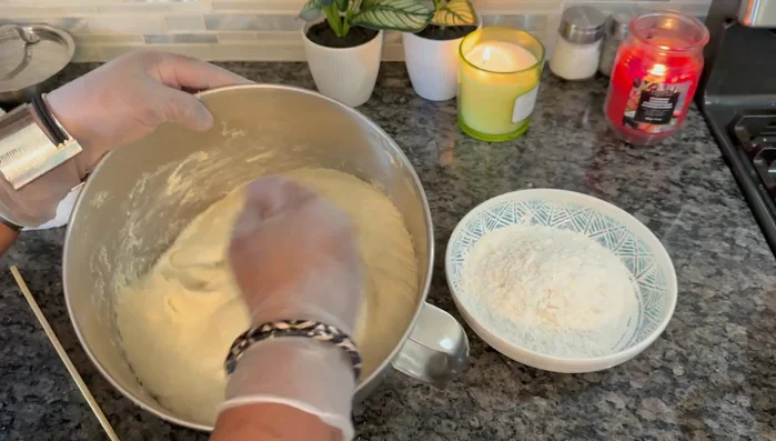 After two hours, punch down the dough and divide it into smaller balls, about the size you want your naan or roti.