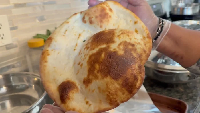 Bake the rotis in the preheated oven for about 5-7 minutes, or until golden brown.