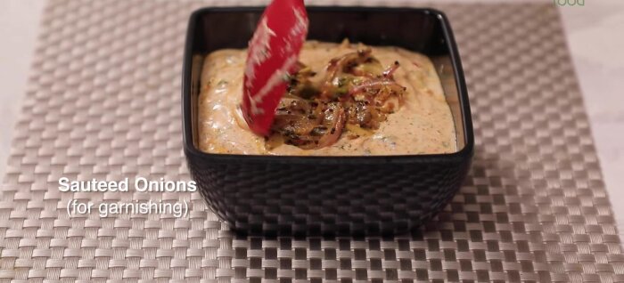 Serve garnished with some onions.