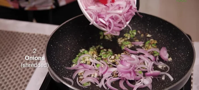 Add 2 shredded onions and sauté for a minute.