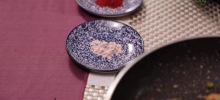 In a bowl, whisk together 2 cups of yogurt, 1/2 teaspoon black salt, 1/2 teaspoon Kashmiri red chili powder, 1 teaspoon cumin powder, and 2 tablespoons coriander leaves. Go easy on salt.