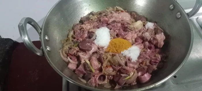 Add salt, turmeric, garam masala, meat masala, cumin, and coriander. Mix well.