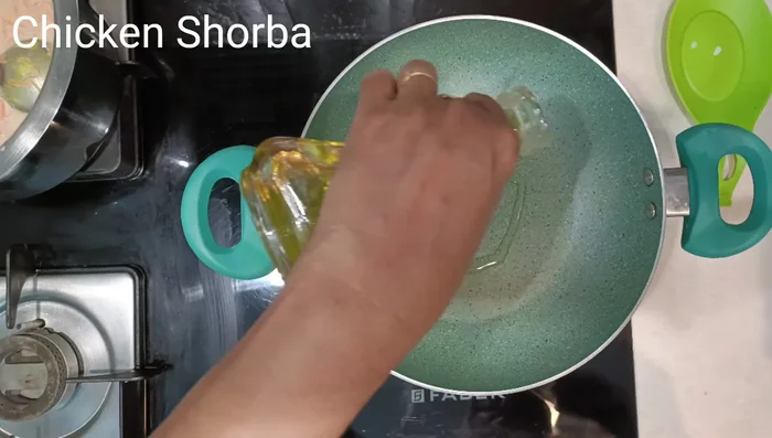 Heat oil and ghee in a kaddai.
