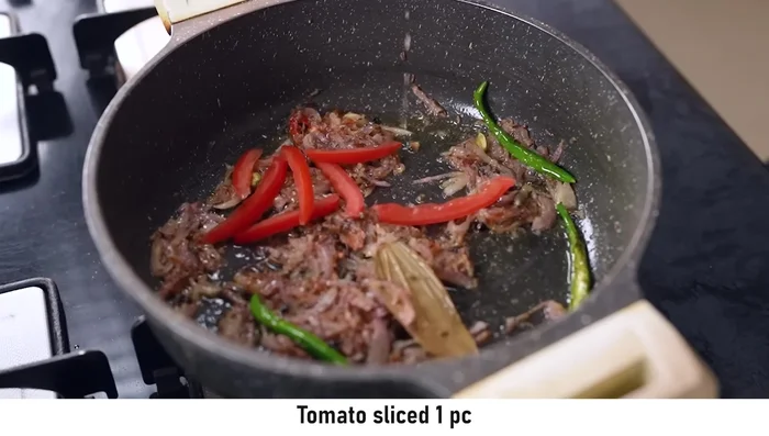 Add sliced tomatoes and cook for 2-3 minutes, until slightly softened.