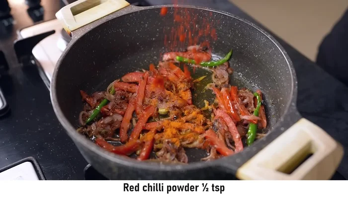 Add turmeric powder, red chili powder, coriander powder, cumin powder, and garam masala powder. Cook for 1-2 minutes.