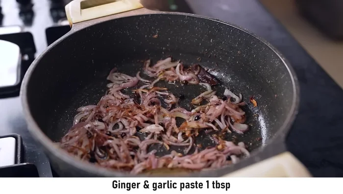 Add ginger-garlic paste and slit green chilies. Cook for 1-2 minutes.