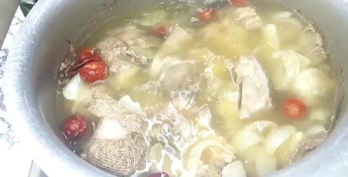Add the ground chilies, and salt to the pot. Bring to a boil, then simmer until the meat is almost cooked.