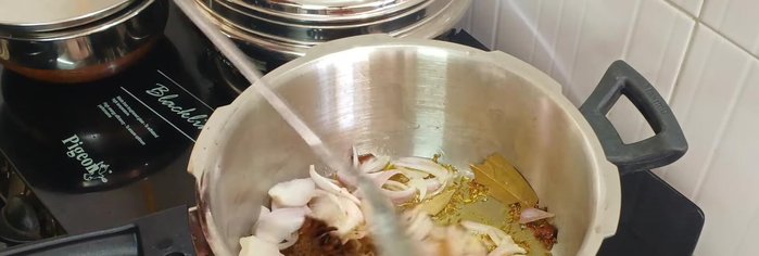 Add thinly sliced onions and sauté until golden brown.