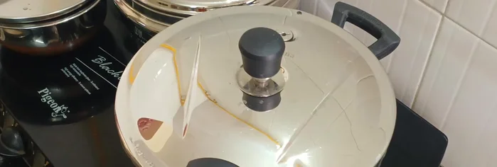 Close the cooker lid and cook on medium heat until 2 whistles.