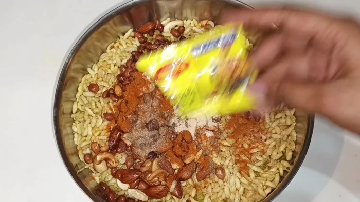 Add salt, black salt, roasted cumin powder, dry mango powder, powdered sugar, and Maggi masala.