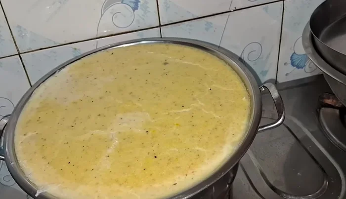 Check if the Kharvas is set by inserting a knife. If it comes out clean, turn off the heat and let it cool.