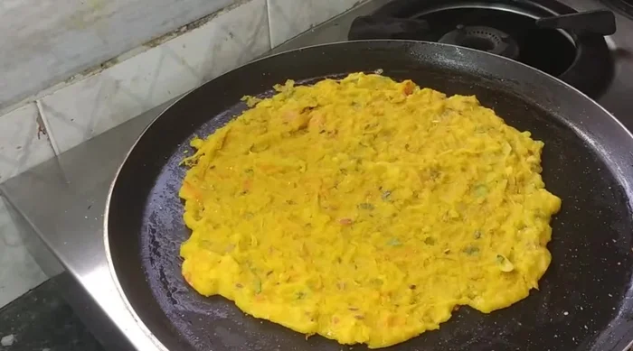 Flip the pancake onto a plate.