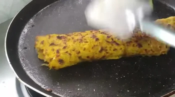 Fold the pancake like a roll.