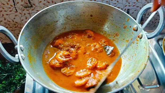 Add 1 glass of water (adjust according to desired gravy consistency). Bring to a boil, then cover and cook on high flame for 4-5 minutes.