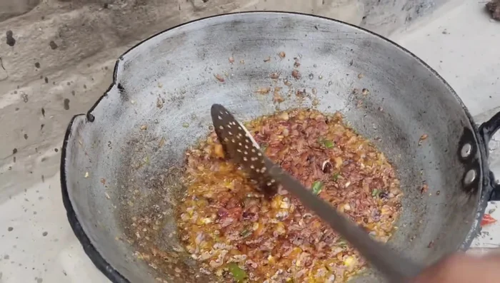 Add the ground masala to the pan and roast it.
